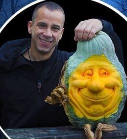 Ray Villafane with one of his squash people carvings